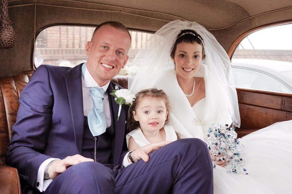 Kelly with her husband and daughter